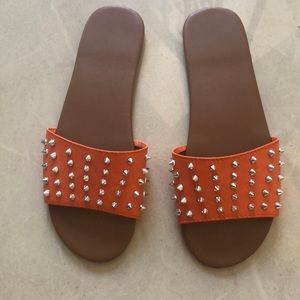 Orange studded slippers